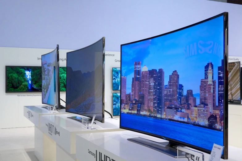 a tv in an electronics store with four screen monitors displayed on each of them