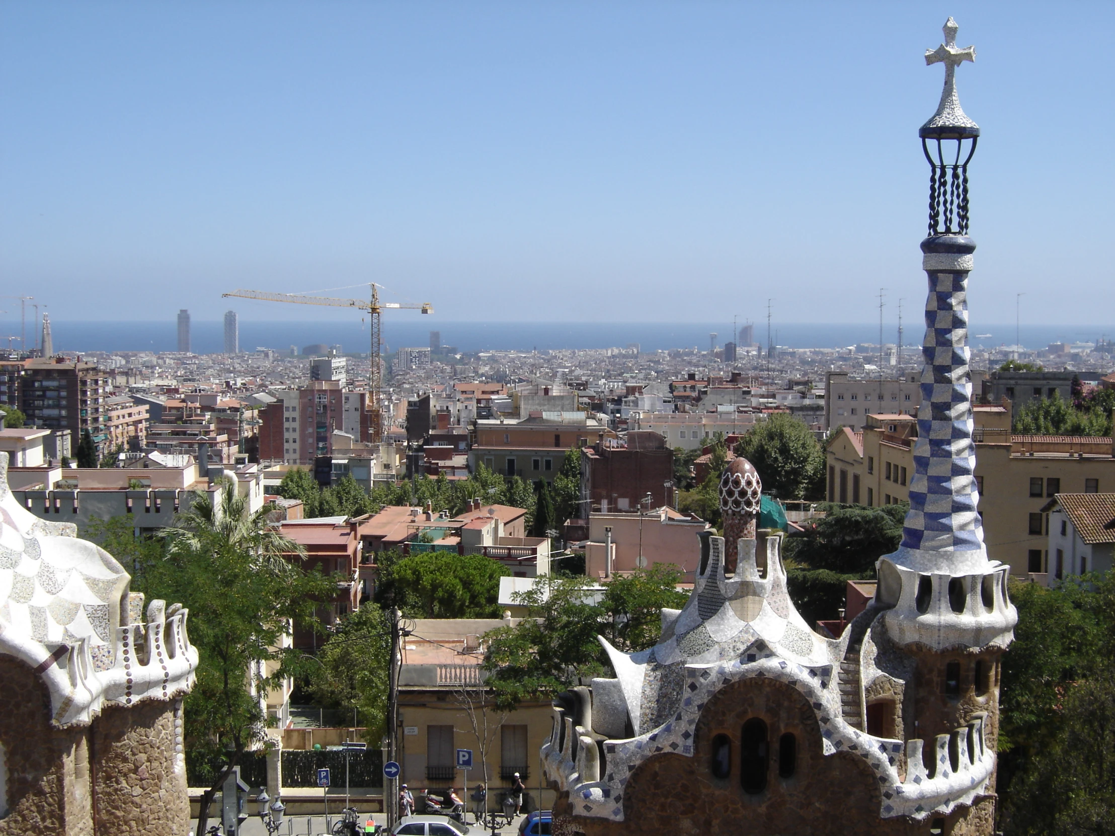 this is a po taken from a viewpoint looking at buildings and a construction crane