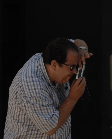 a man holding a cell phone to his ear