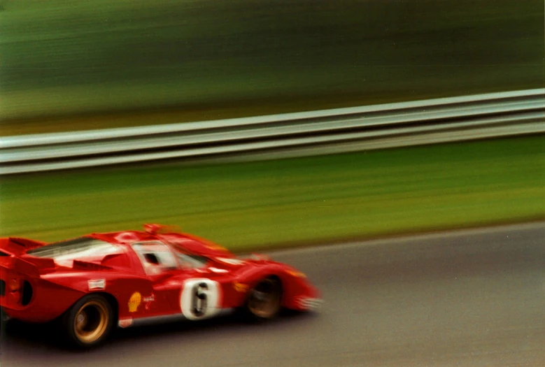 a sports car is driving on a race track