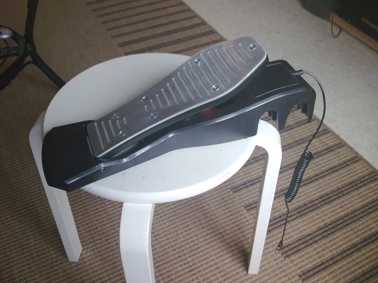 a guitar sitting on top of a white table