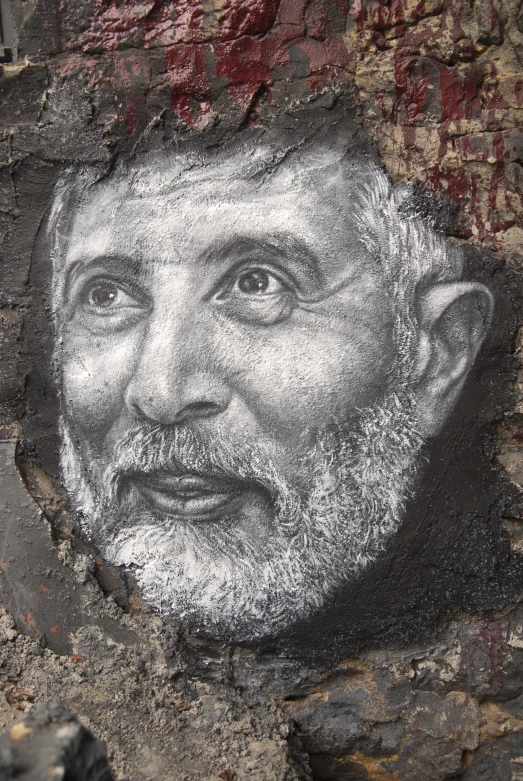 an image of an old man painted on a wall