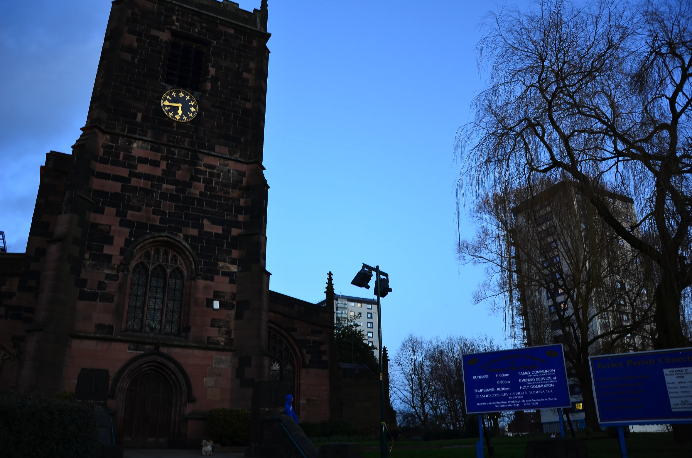 a brown church with a blue sky in the background