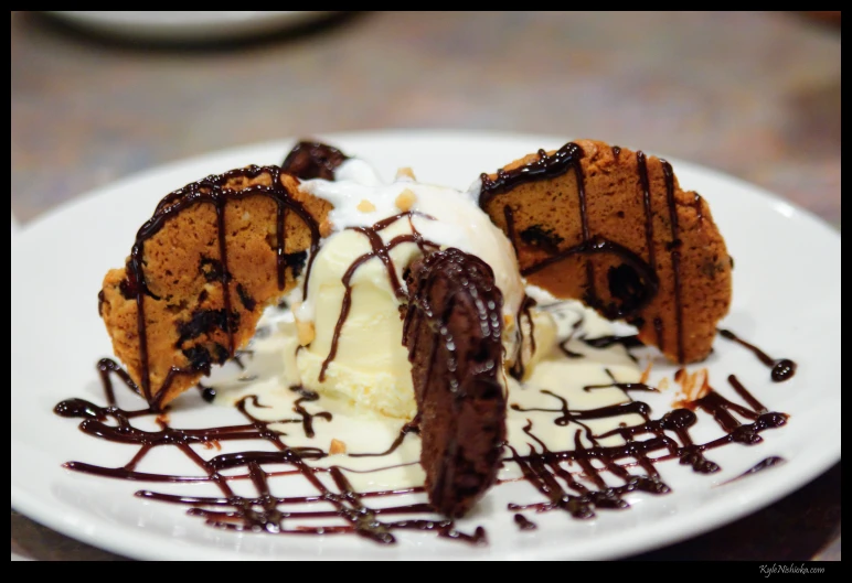 a piece of chocolate cake and ice cream is on the plate