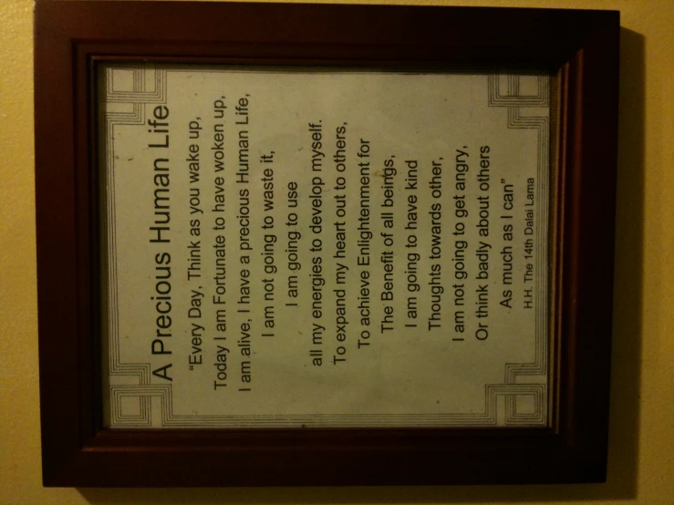 a poem attached to a wall with a picture frame