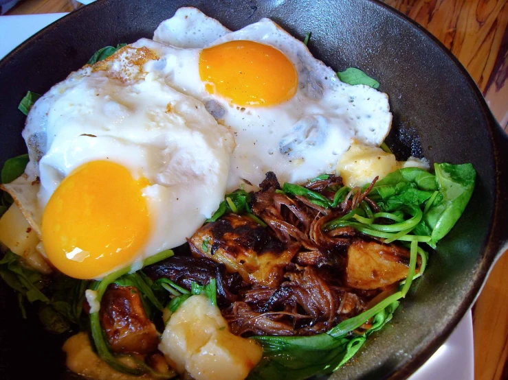 an omelet with hash browns, sausage and lettuce