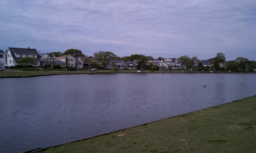 a lake and some houses on the other side