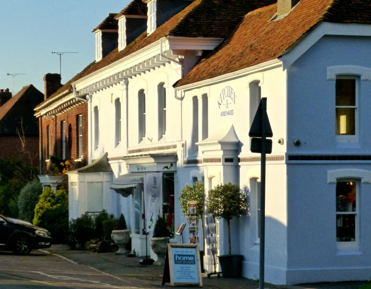 some white buildings on the side of a street