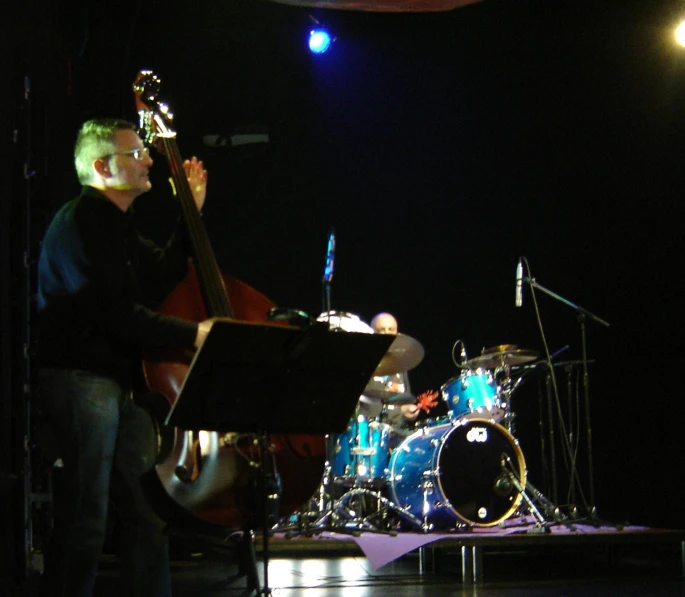 a band playing at night on stage