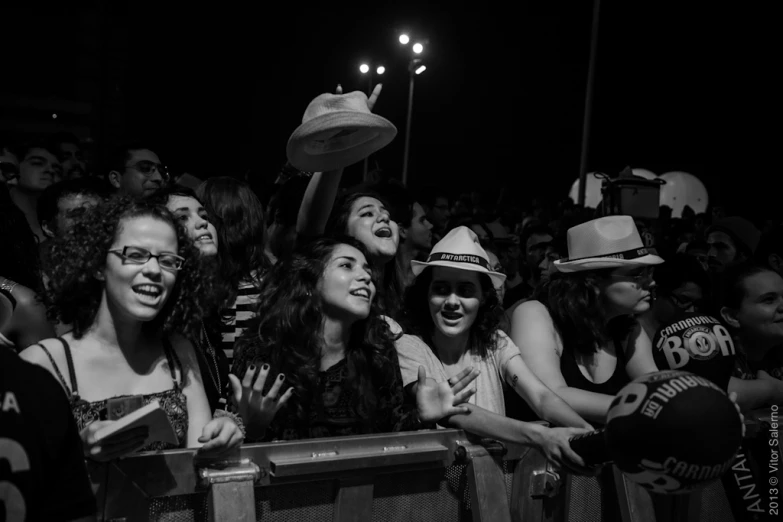 people on a stage at an outdoor concert