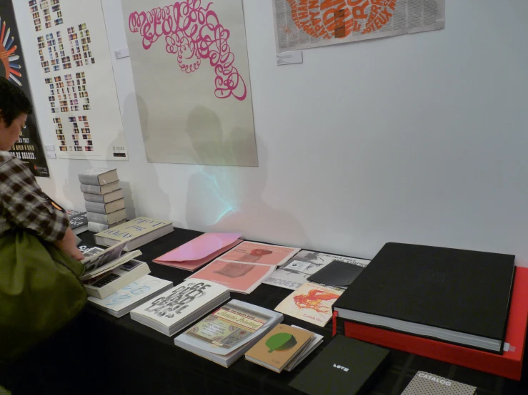 a woman looking at books that she has bought