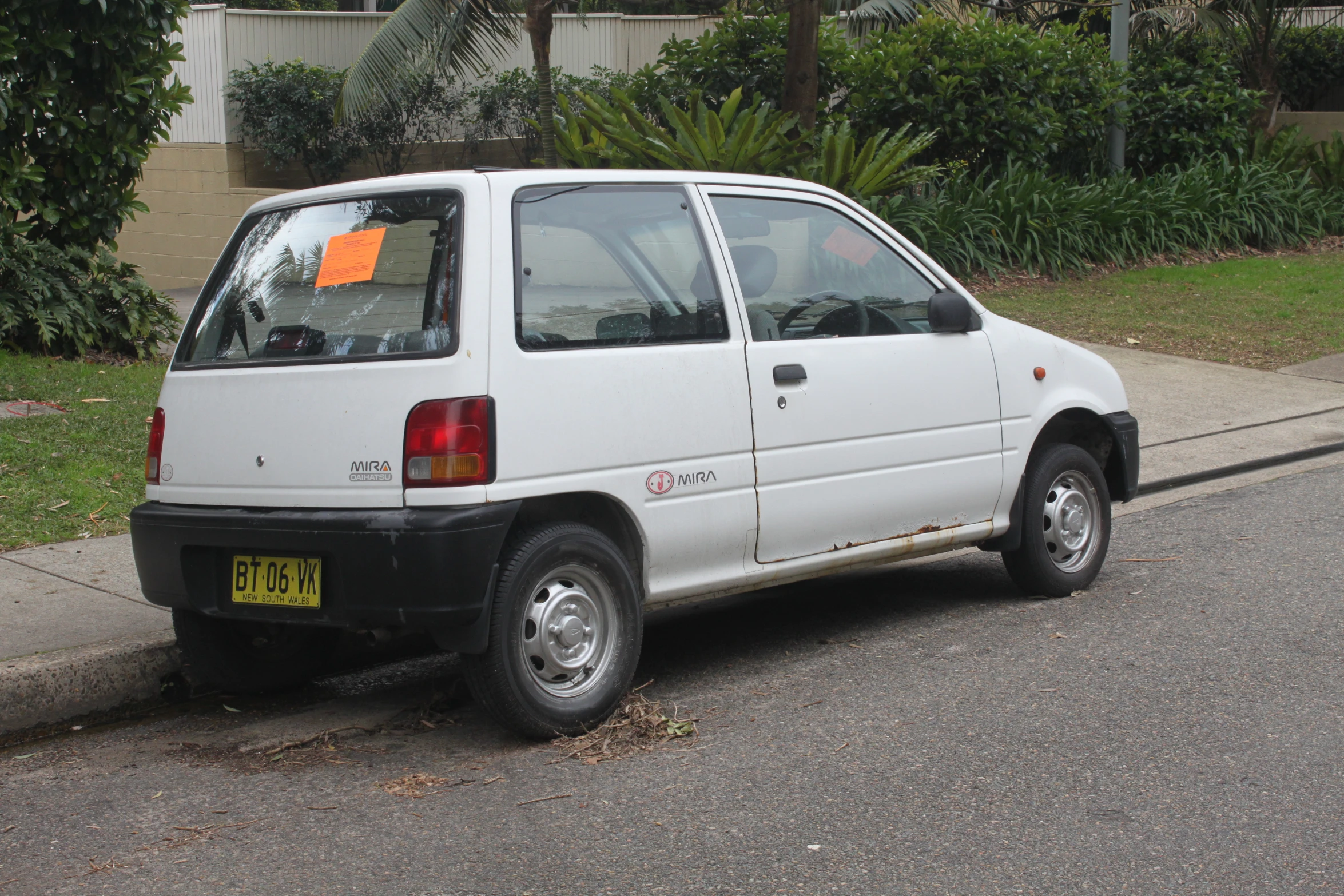 a car is parked along a residential road