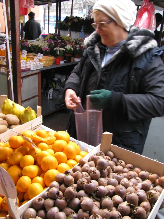 a man with sunglasses is shopping for produce