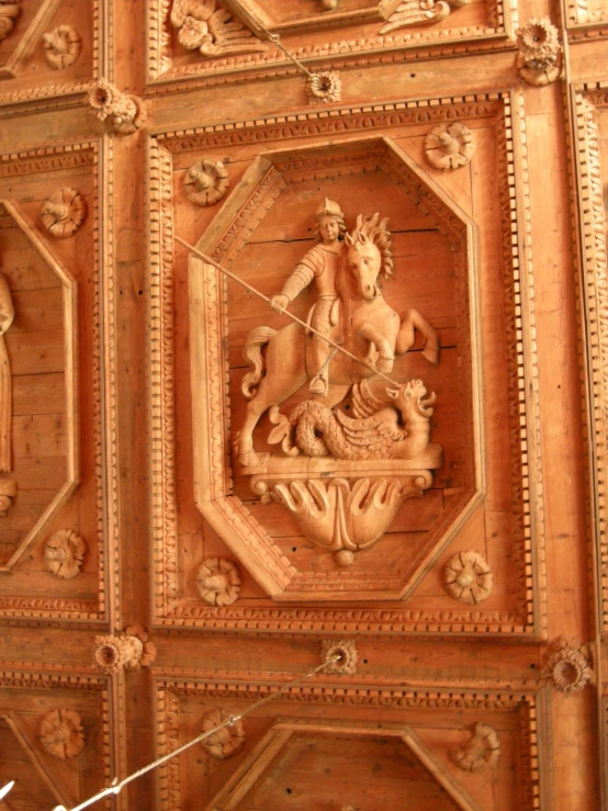 the ornate wooden ceiling of a large building