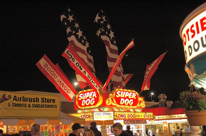 a carnival tent that has various flags on it