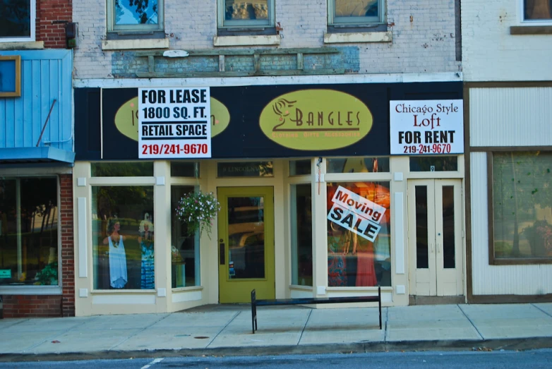 a po of an empty building with signs for sale