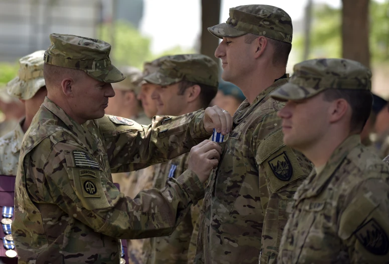 a group of people in uniforms standing around