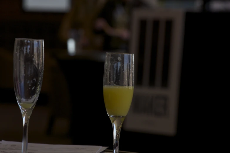 the wine is in glasses that are on the table