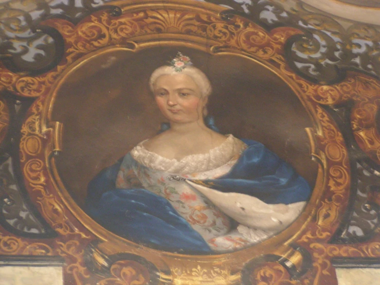 a portrait of a woman with blue and gold clothes