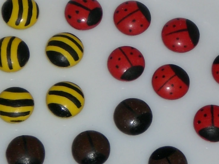 a group of wooden pins sitting on top of a white surface