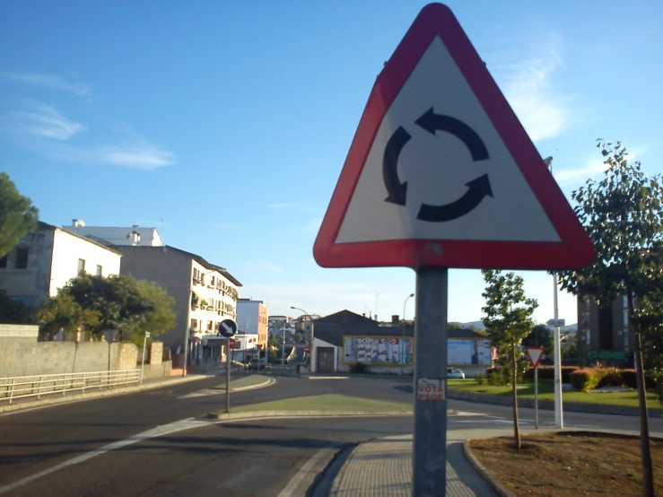 a sign in the road indicating there are three arrows