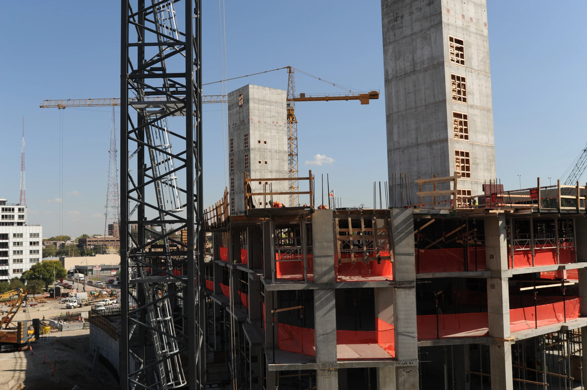 a view of construction and cranes on the side of a building