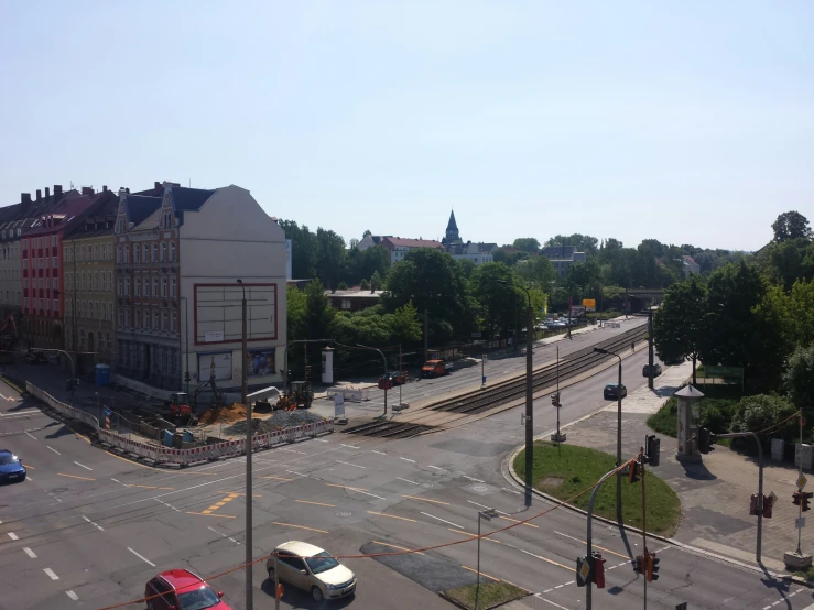 the view from the top of the stairs of a city street