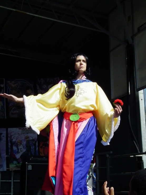 the woman is wearing a bright yellow dress