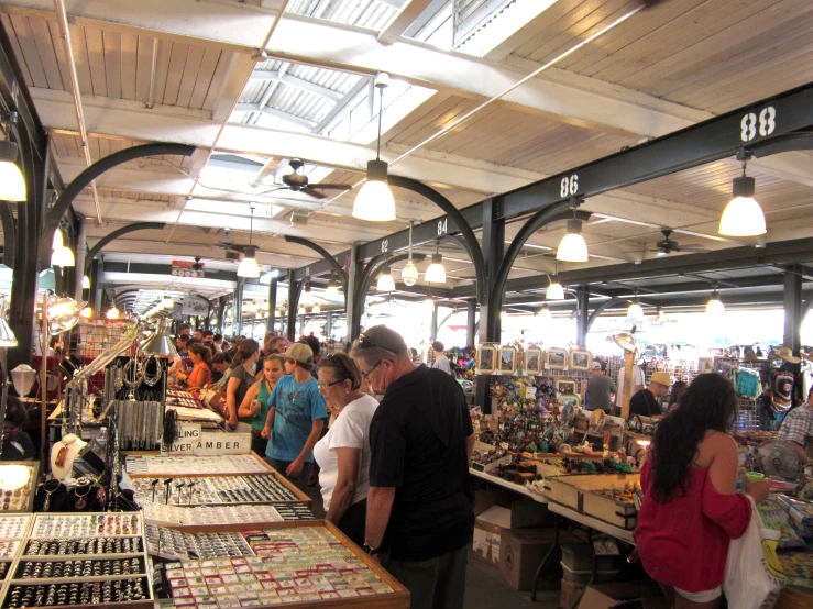 there is an outdoor market that sells items and people