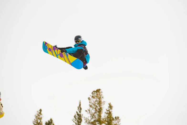 a snow boarder is flying through the air