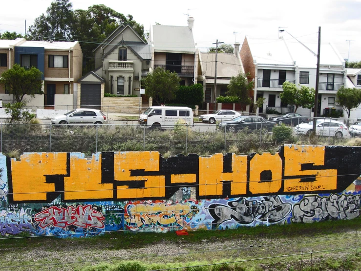 a fence that has some graffiti on it