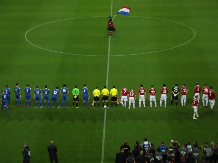 the group is lined up on the soccer field