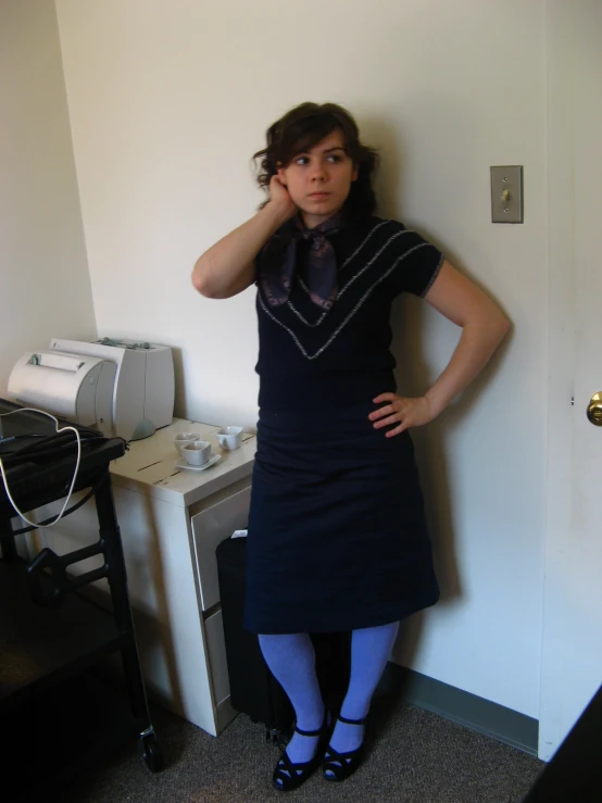 a woman standing near a door in her kitchen