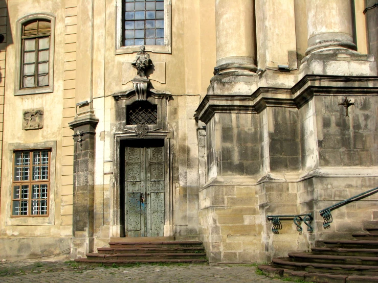 an old building with several steps next to it