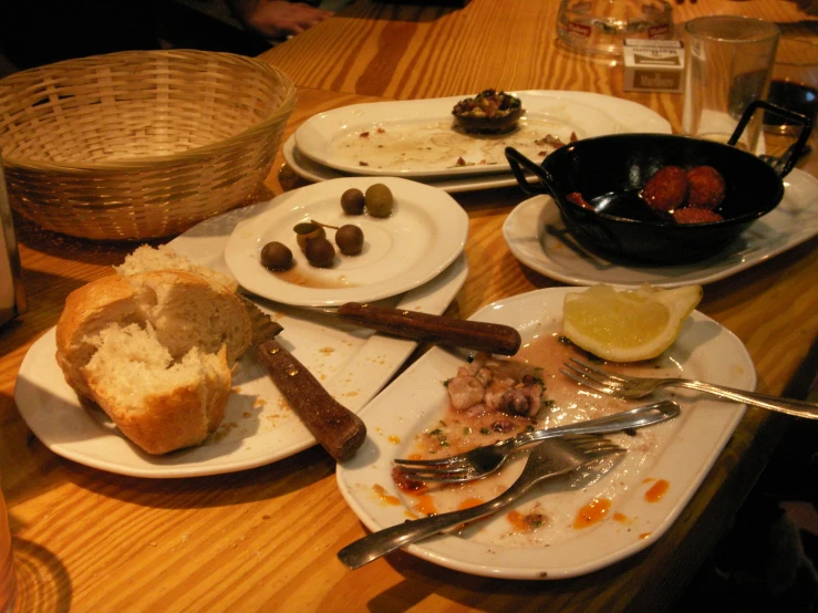 a table has many plates with food on it