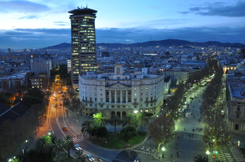 night view of a city and surrounding buildings