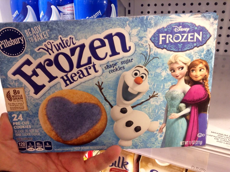 the frozen heart cookies are displayed in a display case