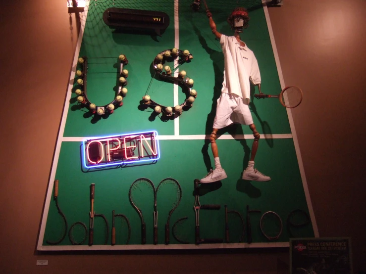 a display of tennis items on display in the museum