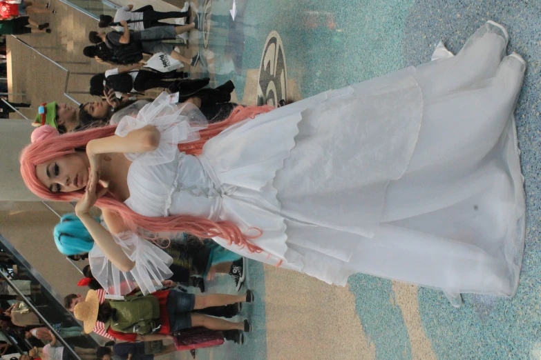 a costumed woman poses for the camera in the middle of a mall