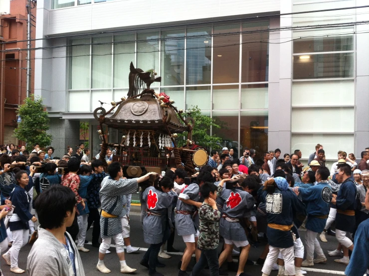 large crowd of people walking and walking in street