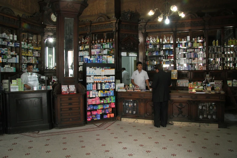 a man standing in a store with lots of liquor