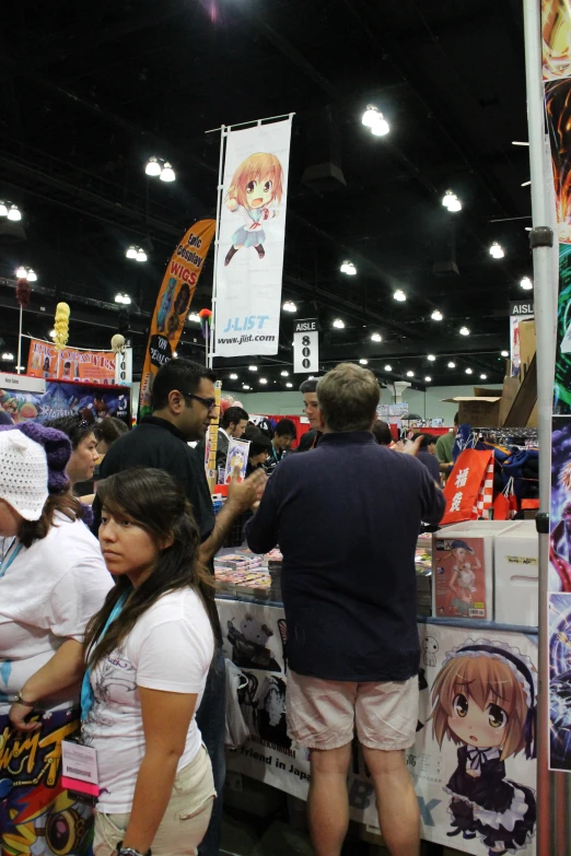 a group of people at a convention shop