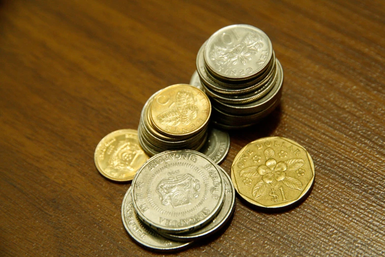 some coins are stacked on top of each other