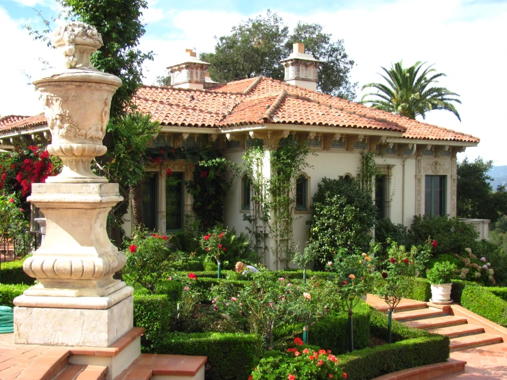 a house sitting on top of a lush green hillside