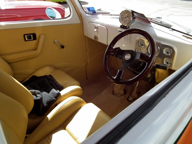 view from the inside of a car of the dashboard, instrument and steering wheel