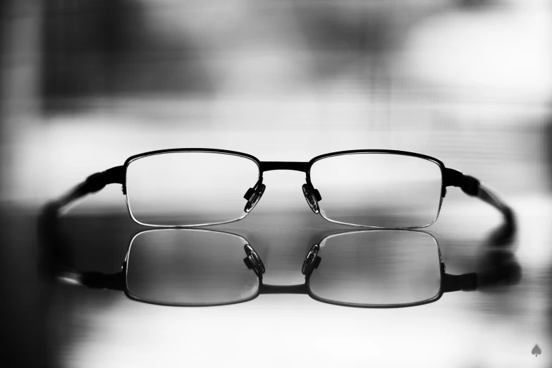 a pair of glasses with reflection on top