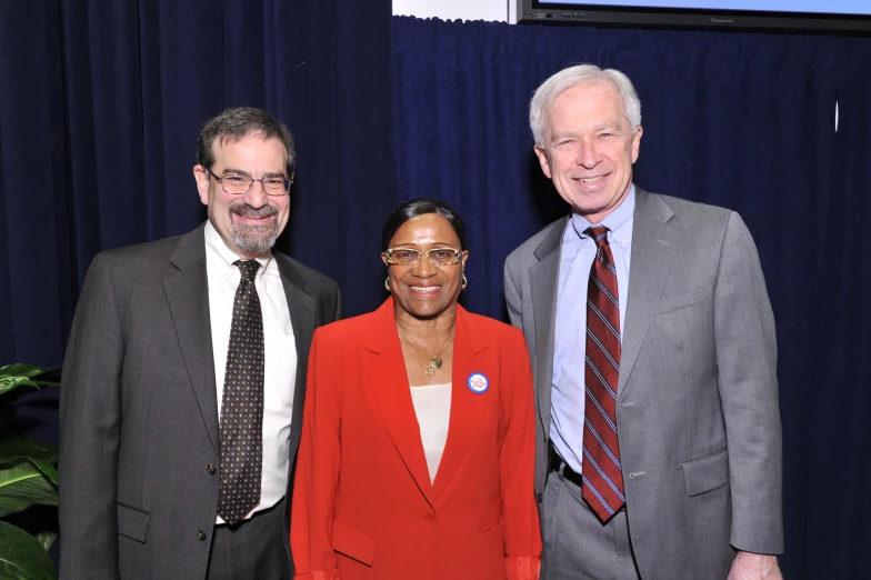 three men and a woman in a business environment