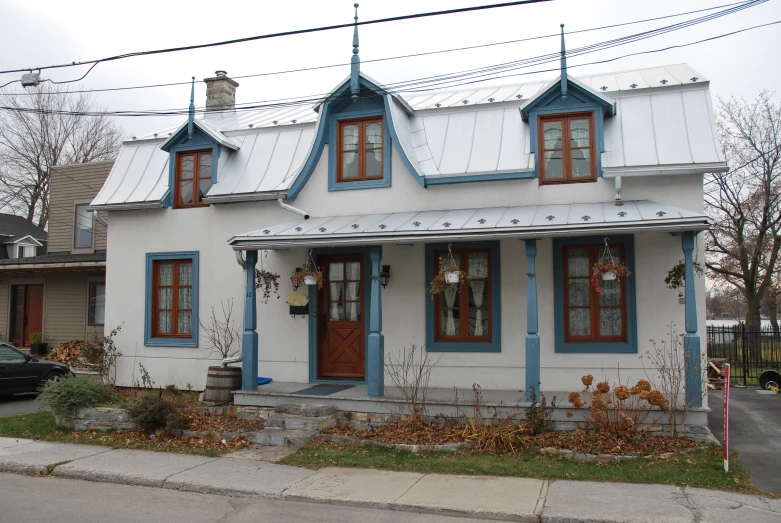 a white house with two different colored windows