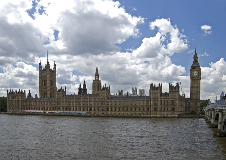 a river runs by a castle with two towers