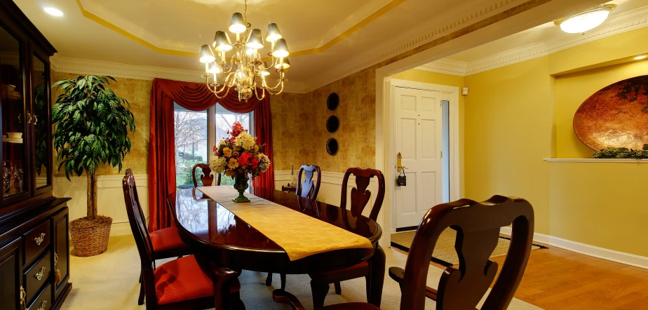 a view of a table and a living area with a fireplace